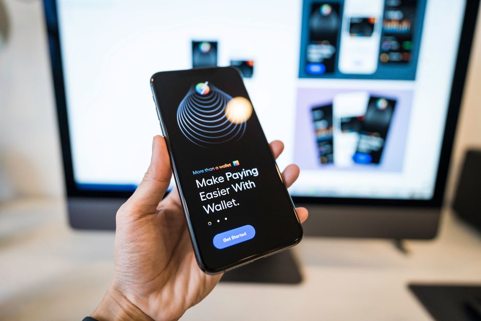 A person using a custom mobile banking app on a smartphone, showcasing modern fintech solutions.